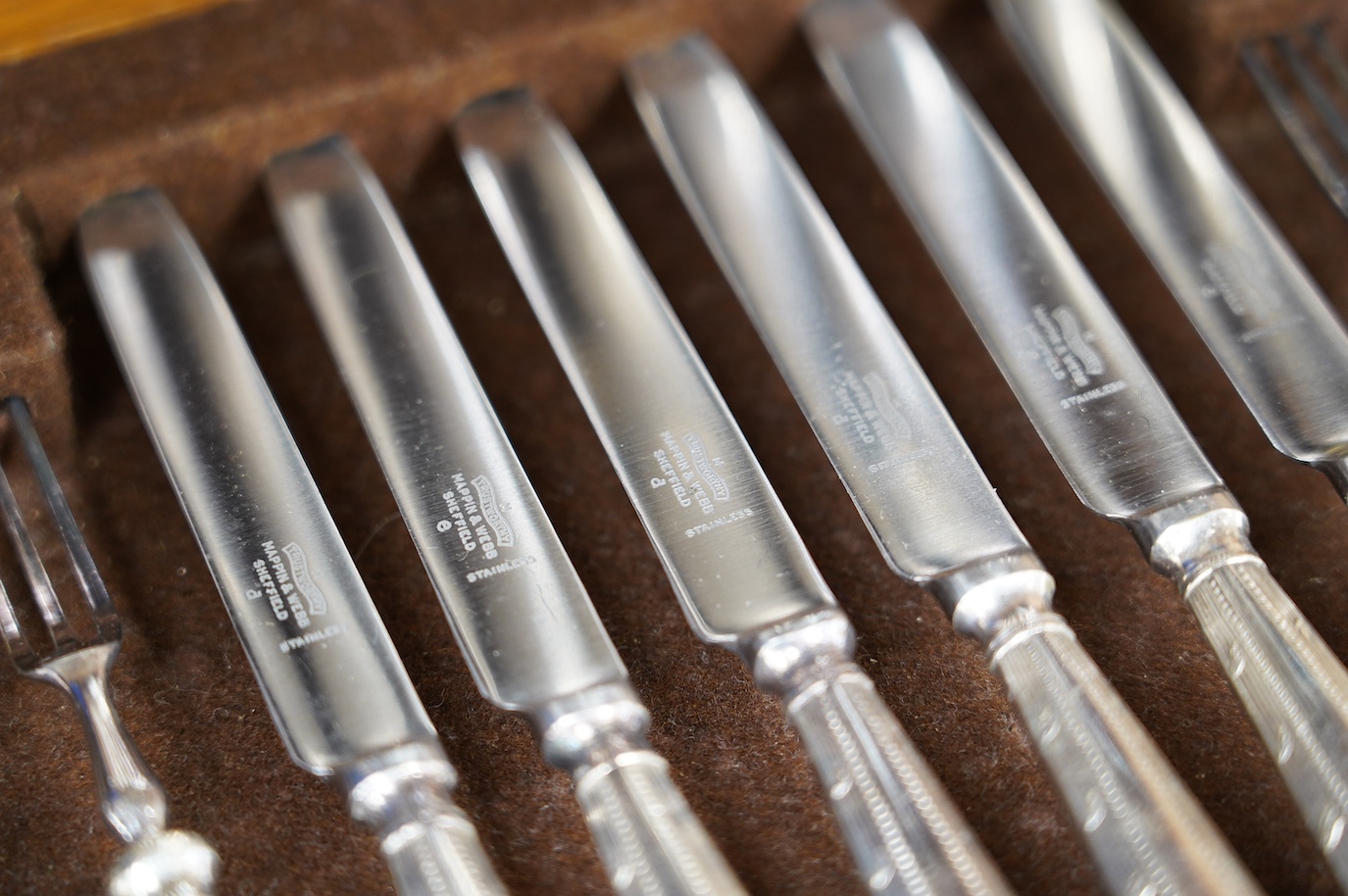 A cased set of six silver handled tea knives and six other cased plated sets. Condition - fair